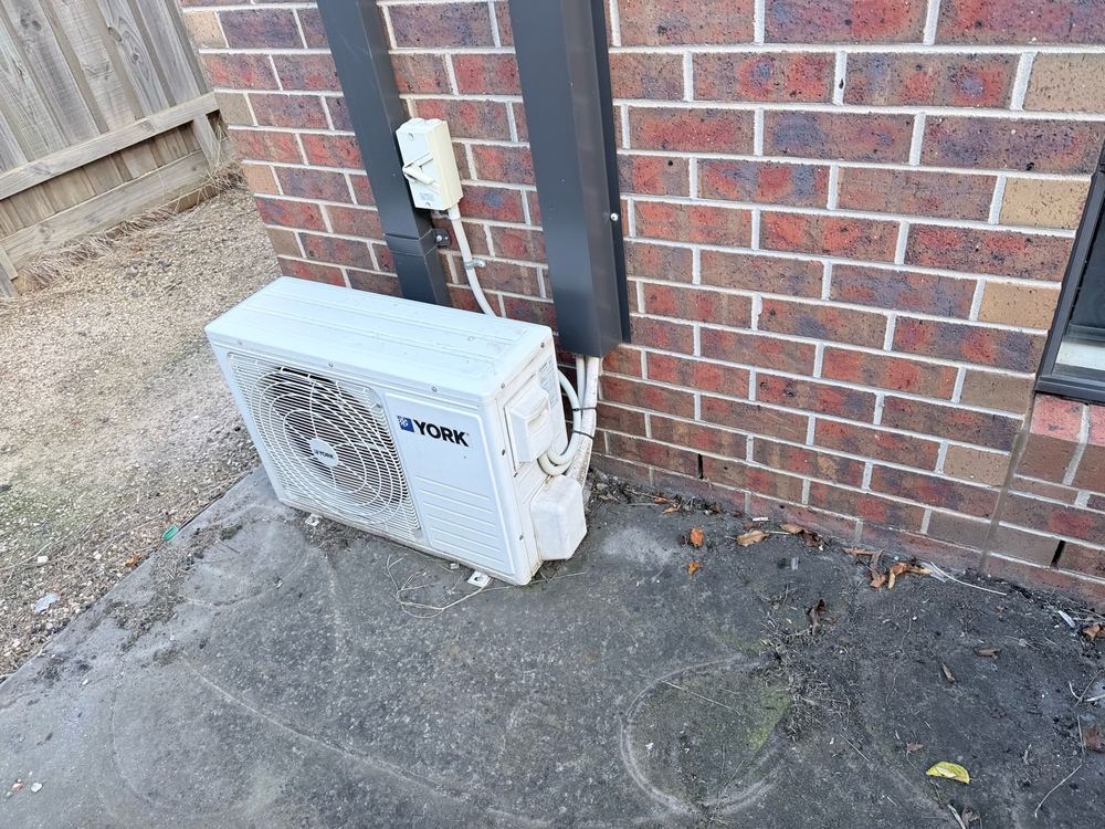 Condensate drain stopping short of a safe distance from the footings, found during a defect investigation inspection in Truganina