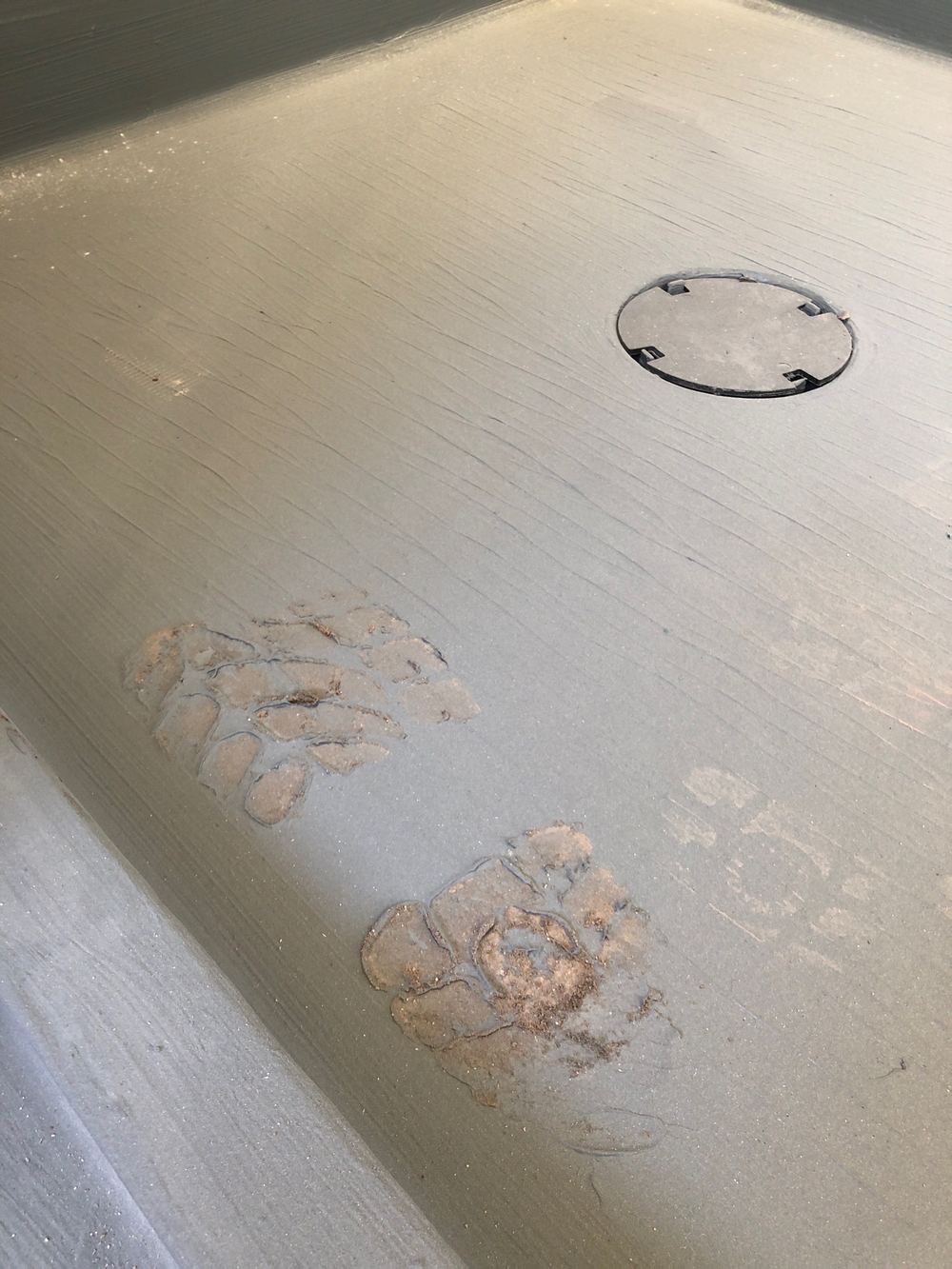 Shower membrane damaged and needing repair before any tile is laid, found during a waterproofing inspection in Truganina